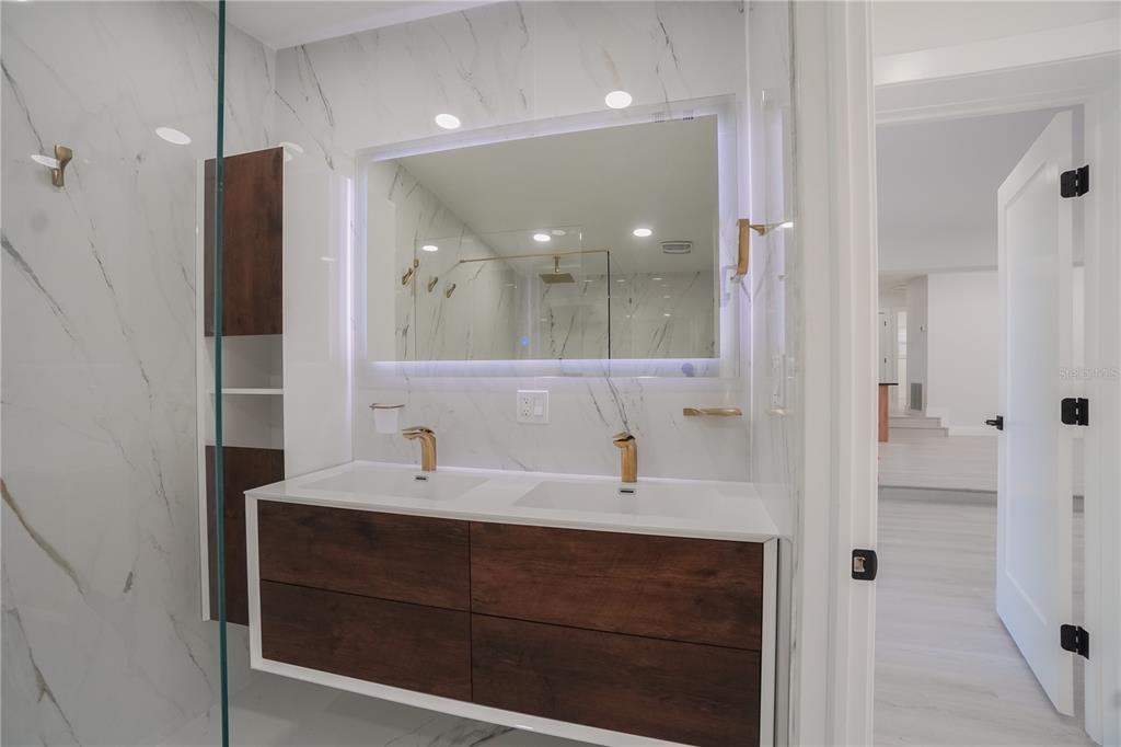 6821 Marius Road North Port, FL 34287 - Photo 15 of 39 a bathroom with a sink and a mirror