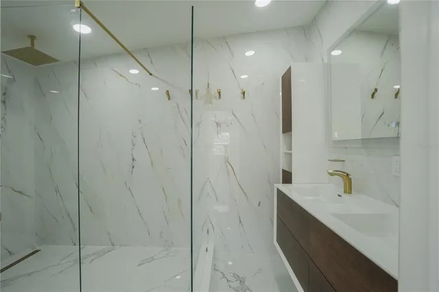 a bathroom with a shower and a sink