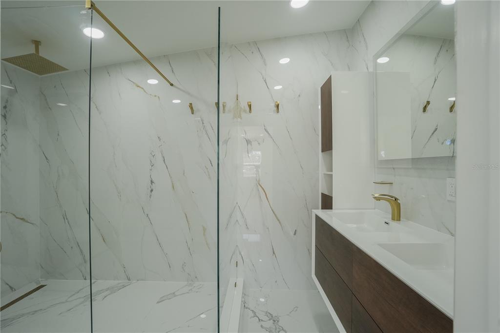 6821 Marius Road North Port, FL 34287 - Photo 16 of 39 a bathroom with a shower and a sink