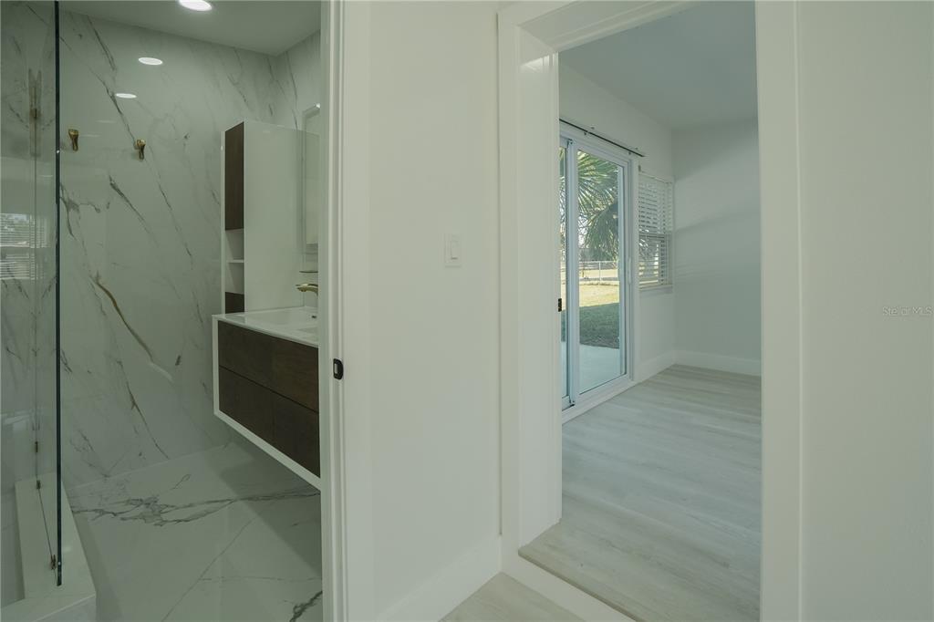 6821 Marius Road North Port, FL 34287 - Photo 18 of 39 a bathroom with a shower and a sink
