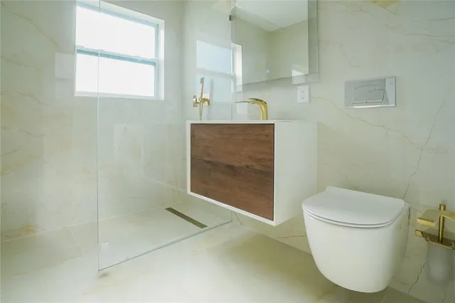 a bathroom with a sink a vanity a window and a mirror