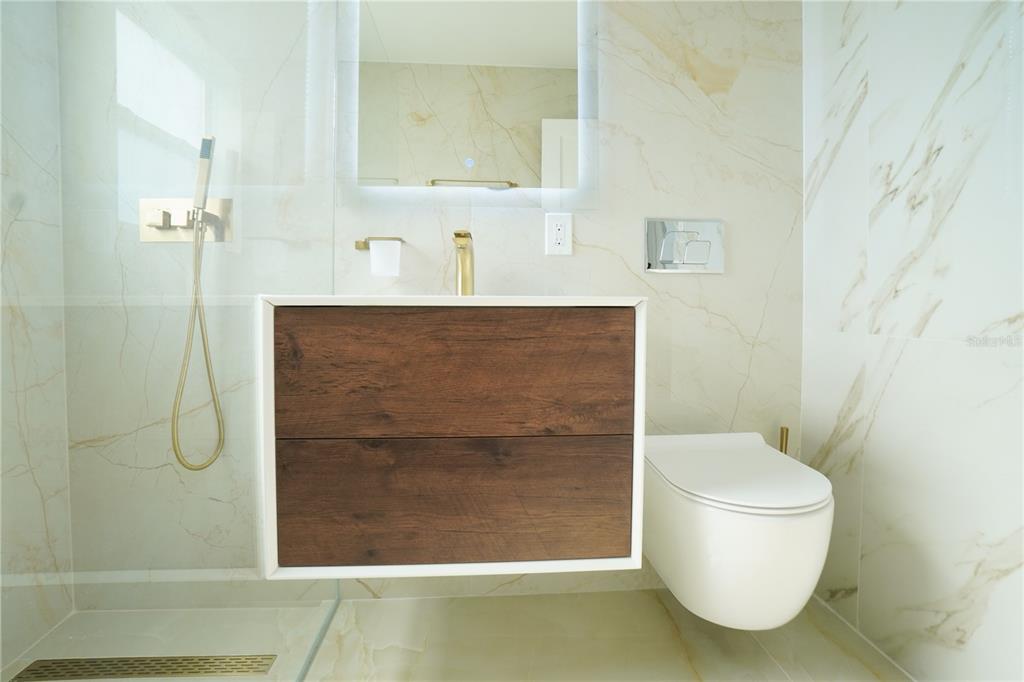 6821 Marius Road North Port, FL 34287 - Photo 23 of 39 a bathroom with a toilet and a shower