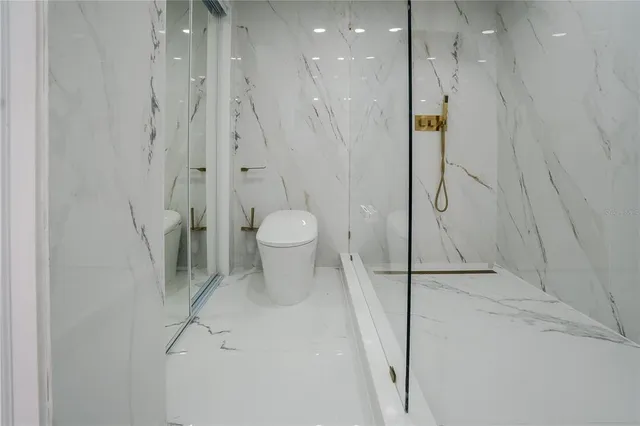 a view of a bathroom with a washer and dryer