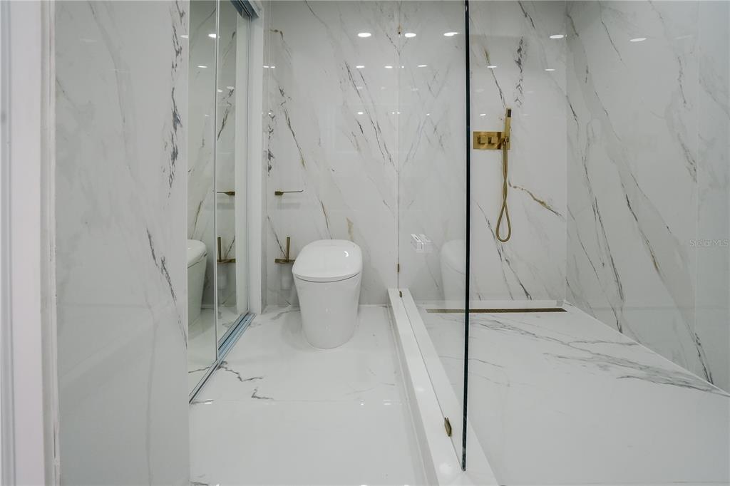 6821 Marius Road North Port, FL 34287 - Photo 30 of 39 a bathroom with a shower and a toilet