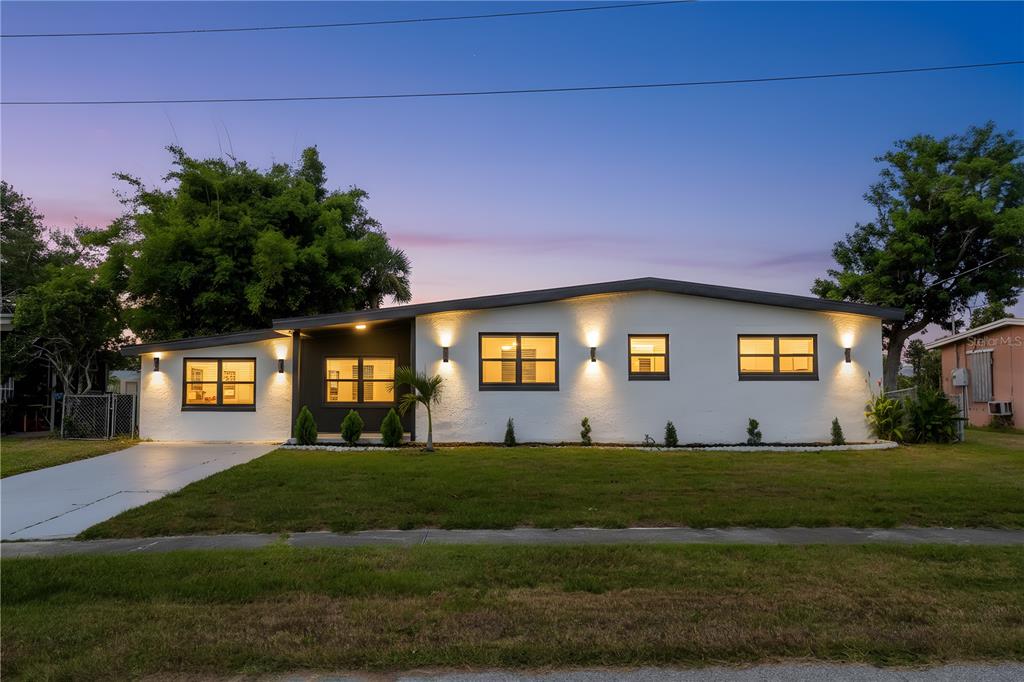 6821 Marius Road North Port, FL 34287 - Photo 3 of 39 a front view of a house with a yard