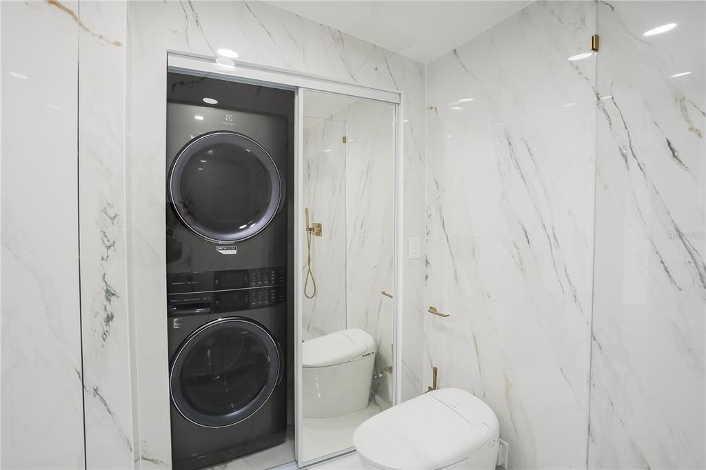 6821 Marius Road North Port, FL 34287 - Photo 32 of 39 a view of a bathroom with a washer and dryer