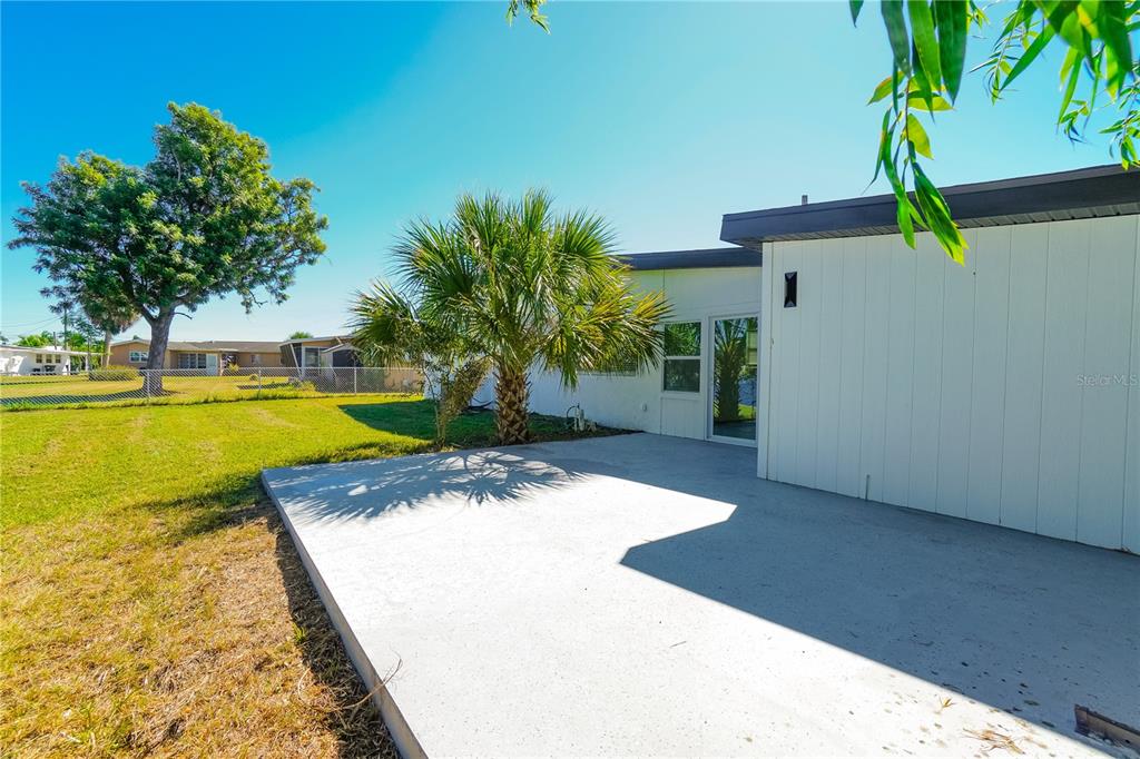 6821 Marius Road North Port, FL 34287 - Photo 34 of 39 a view of a swimming pool with an outdoor space