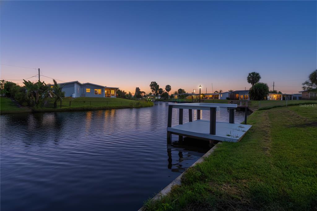 6821 Marius Road North Port, FL 34287 - Photo 37 of 39 a view of a lake with a house in the background