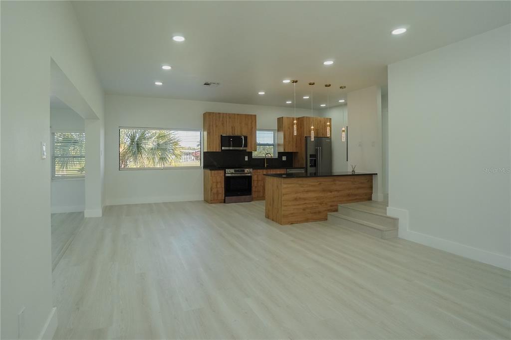 6821 Marius Road North Port, FL 34287 - Photo 5 of 39 a view of kitchen and hall with wooden floor
