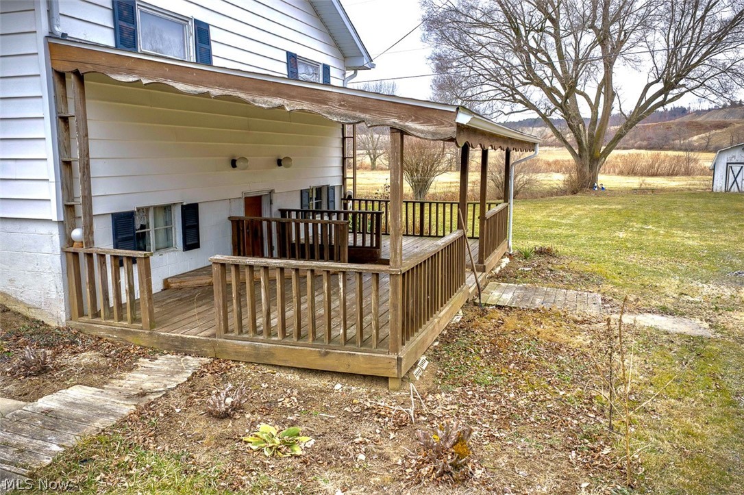 3336 Broad Run Dairy Road Northwest Dover, OH 44622 - Photo 6 of 26 Wooden terrace featuring a yard