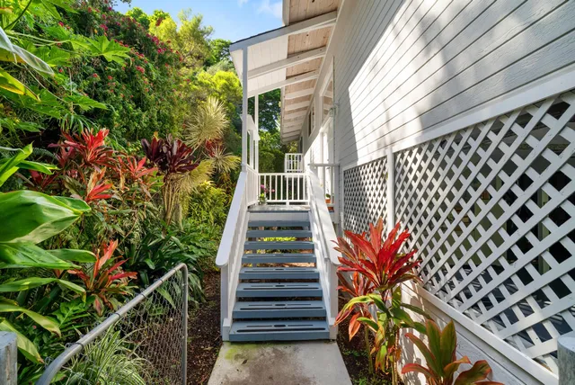 a view of a backyard with sitting area