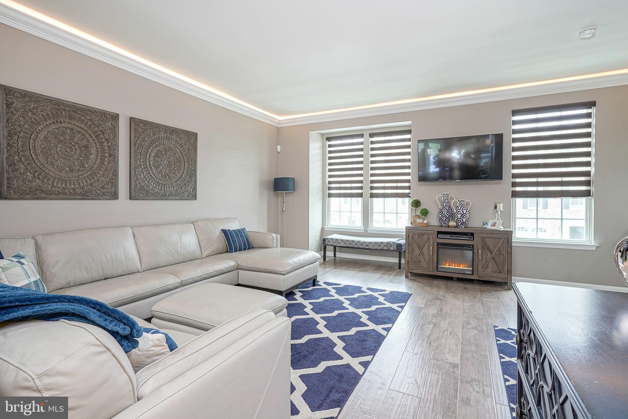 1056 Prime Place Sewell, NJ 08080 - Photo 23 of 41 a living room with furniture and a flat screen tv