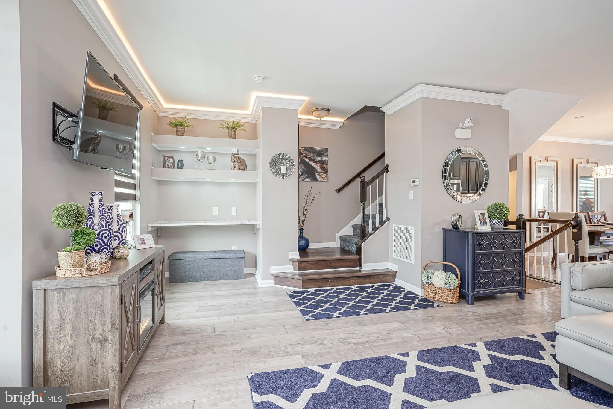 1056 Prime Place Sewell, NJ 08080 - Photo 24 of 41 a living room with furniture and a painting on the wall