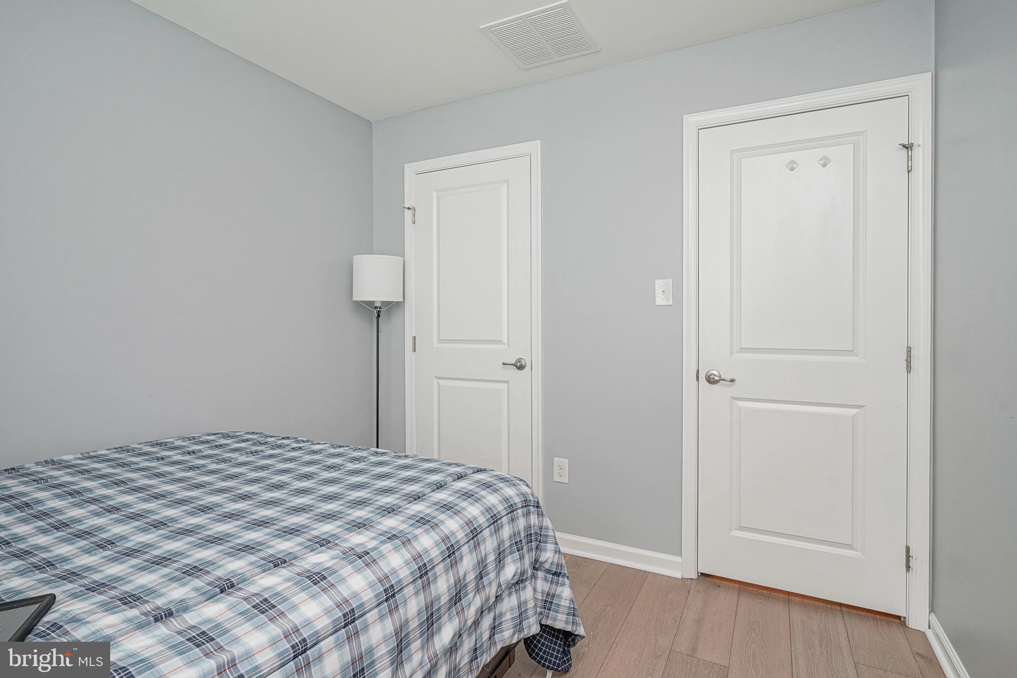 1056 Prime Place Sewell, NJ 08080 - Photo 28 of 41 a bedroom with a bed and wooden floor