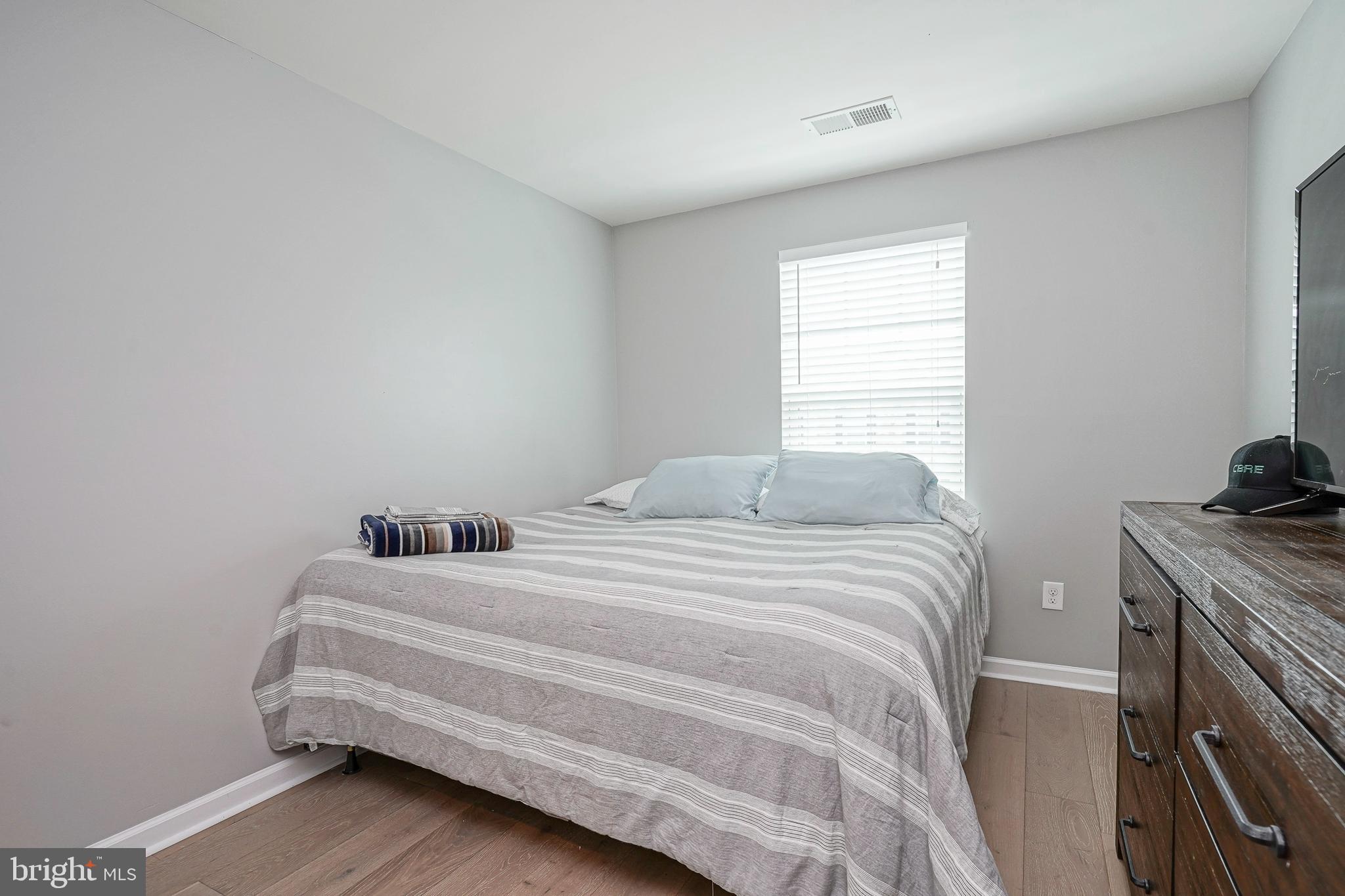 1056 Prime Place Sewell, NJ 08080 - Photo 31 of 41 a bedroom with a bed and a window