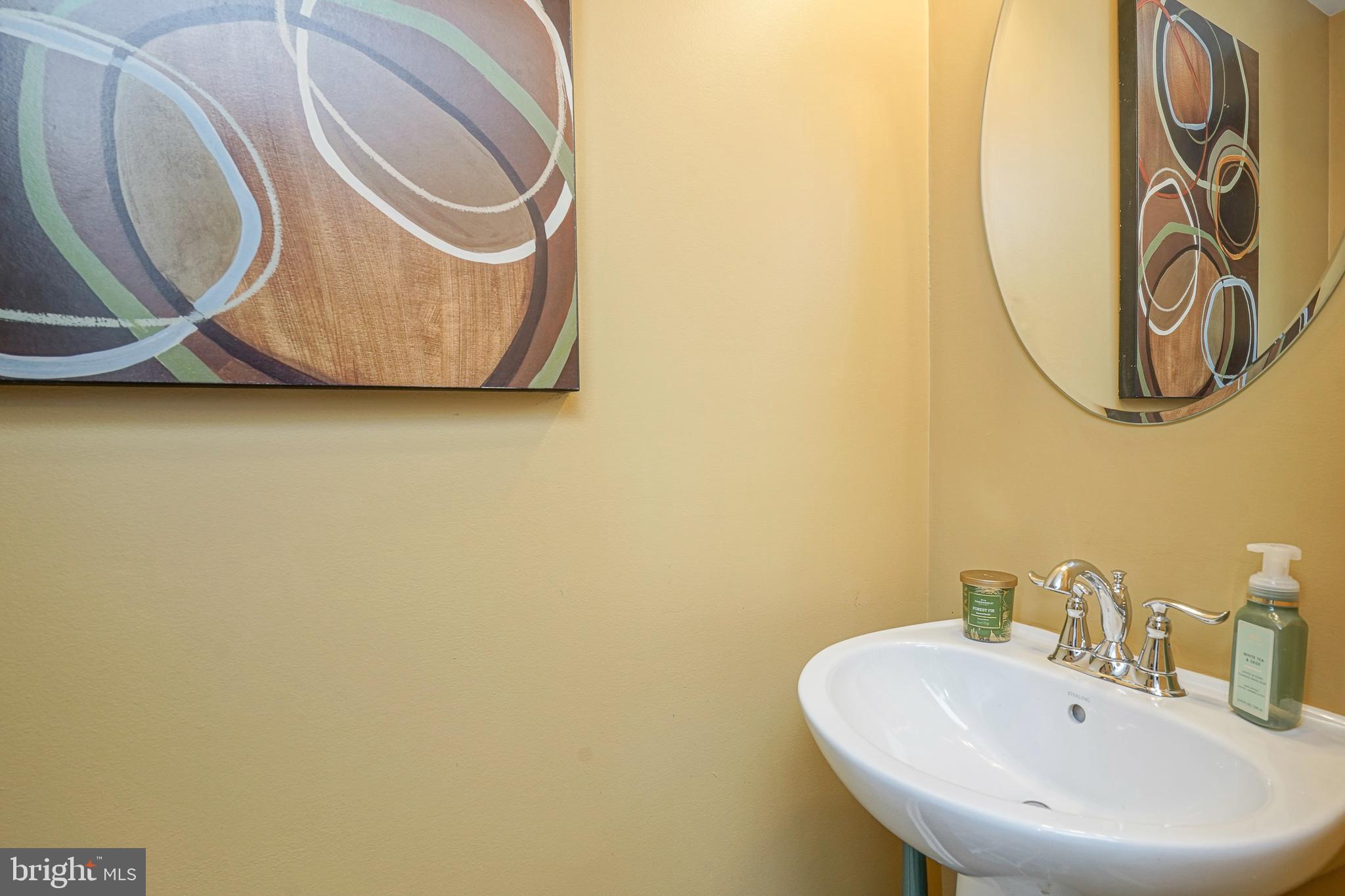1056 Prime Place Sewell, NJ 08080 - Photo 4 of 41 a bathroom with a sink and a mirror
