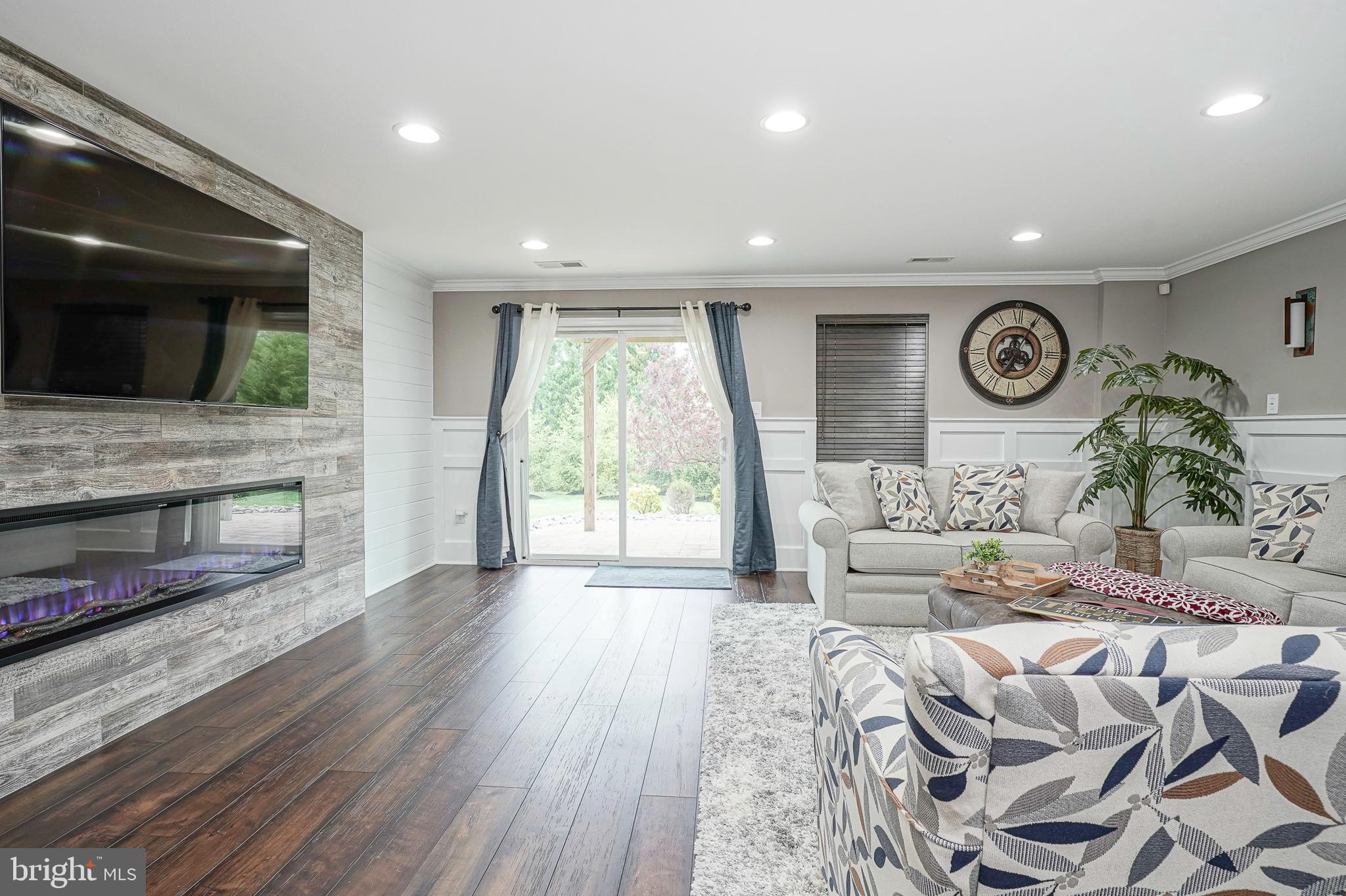 1056 Prime Place Sewell, NJ 08080 - Photo 6 of 41 a living room with furniture wooden floor and a fireplace