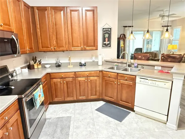 a kitchen with a sink stove and cabinets