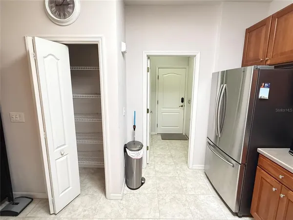 a kitchen with a refrigerator and a sink