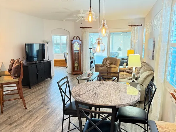 a view of a dining room with furniture and wooden floor