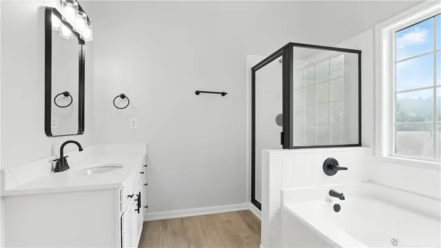 a bathroom with a tub and sink