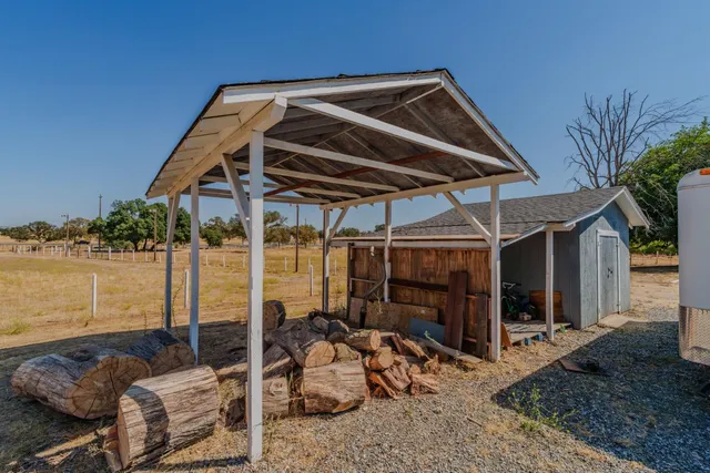 a blue and white table sitting in front of a house