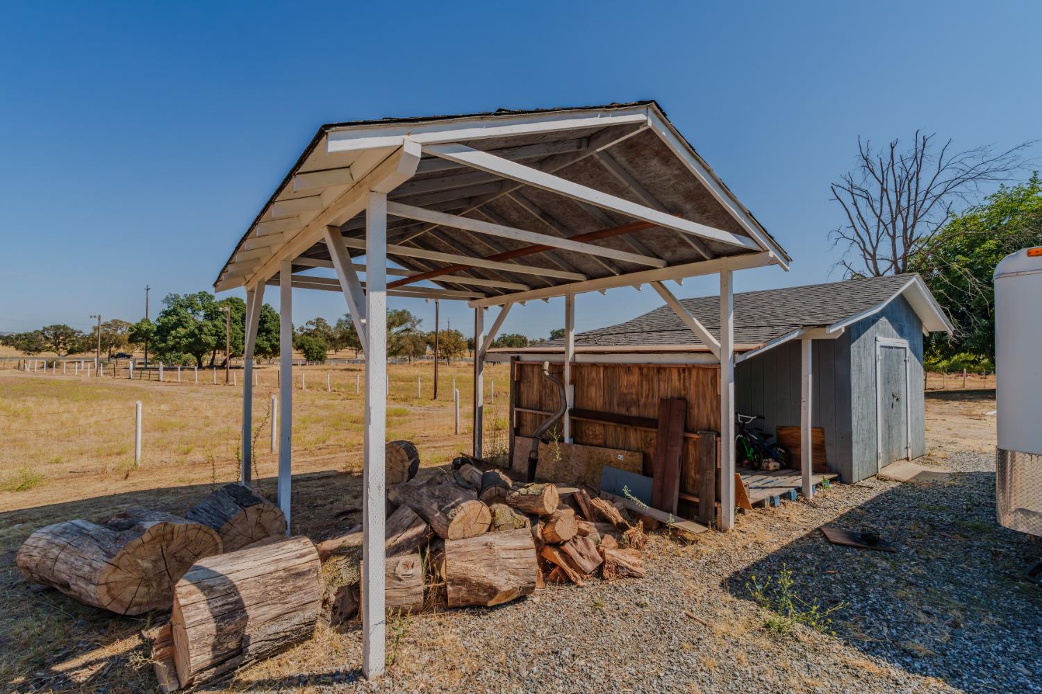 9680 Warren Road Valley Springs, CA 95252 - Photo 14 of 51 a blue and white table sitting in front of a house