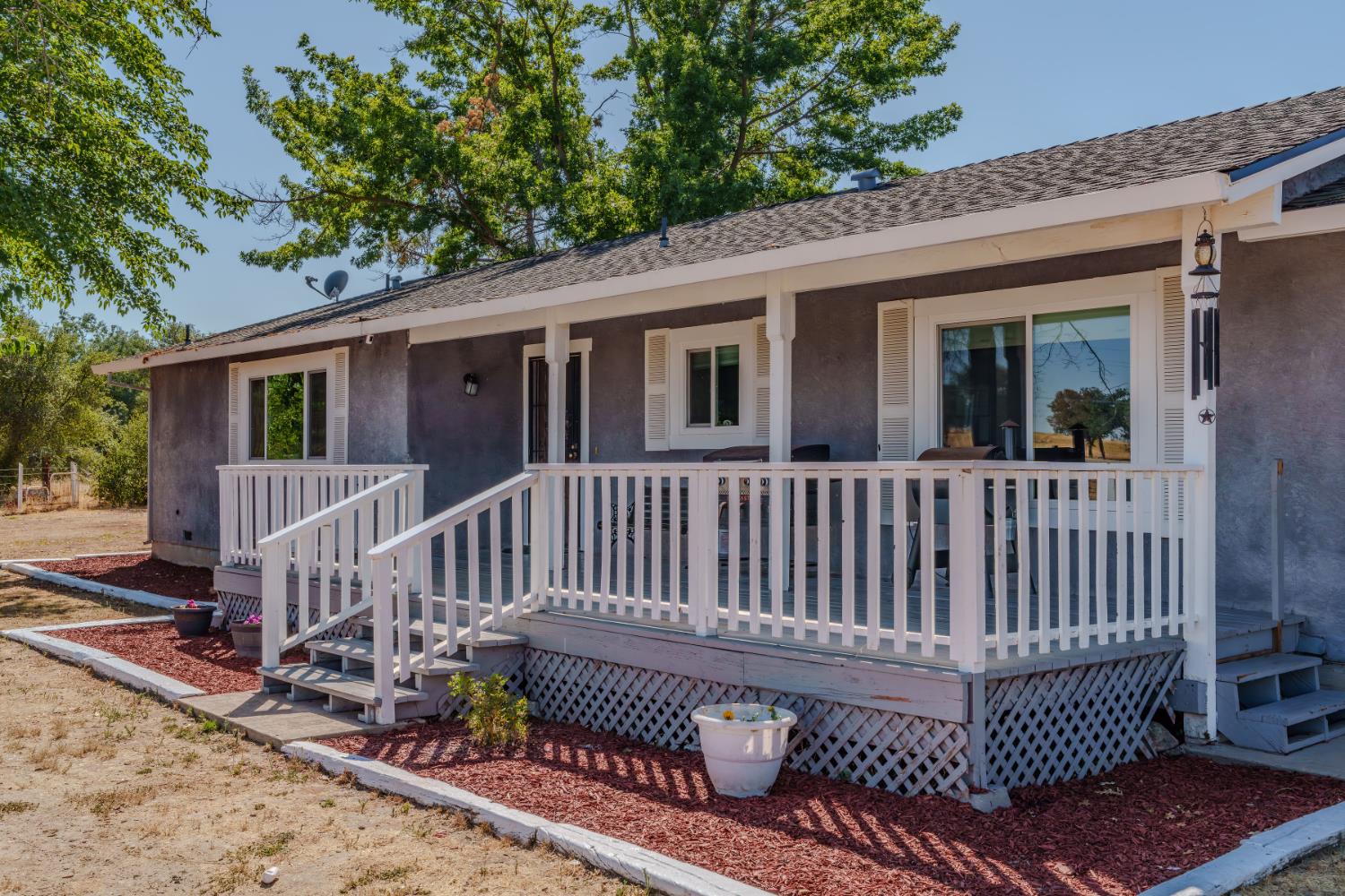 9680 Warren Road Valley Springs, CA 95252 - Photo 2 of 51 a view of a deck with a chair and fence