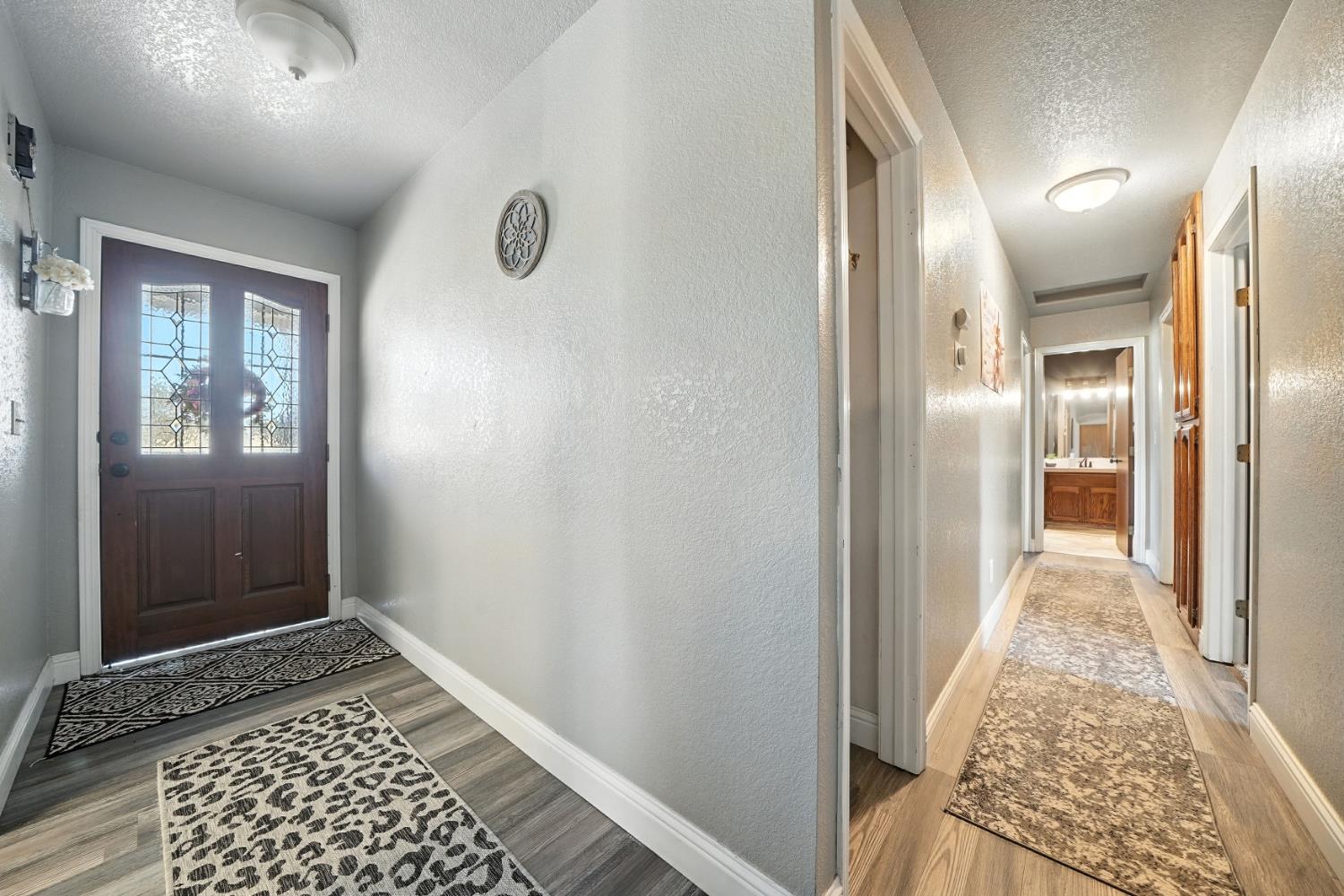 9680 Warren Road Valley Springs, CA 95252 - Photo 28 of 51 a view of hallway with wooden floor