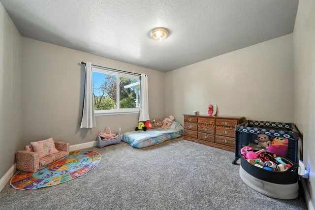 a bedroom with furniture and a toys