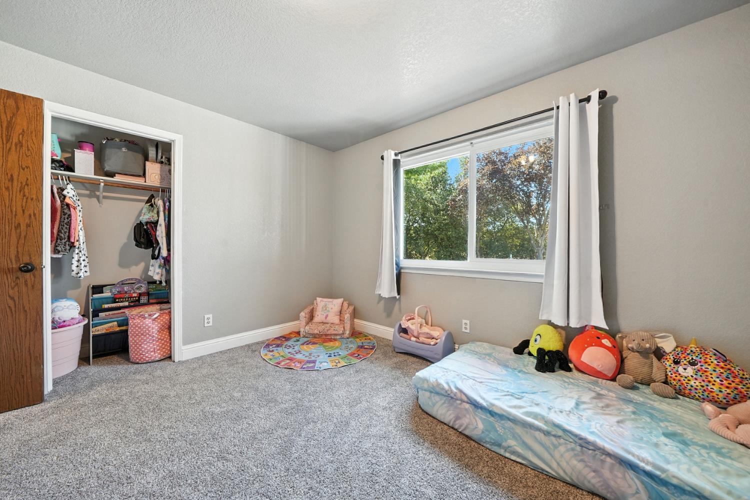 9680 Warren Road Valley Springs, CA 95252 - Photo 38 of 51 a bedroom with two beds and large windows