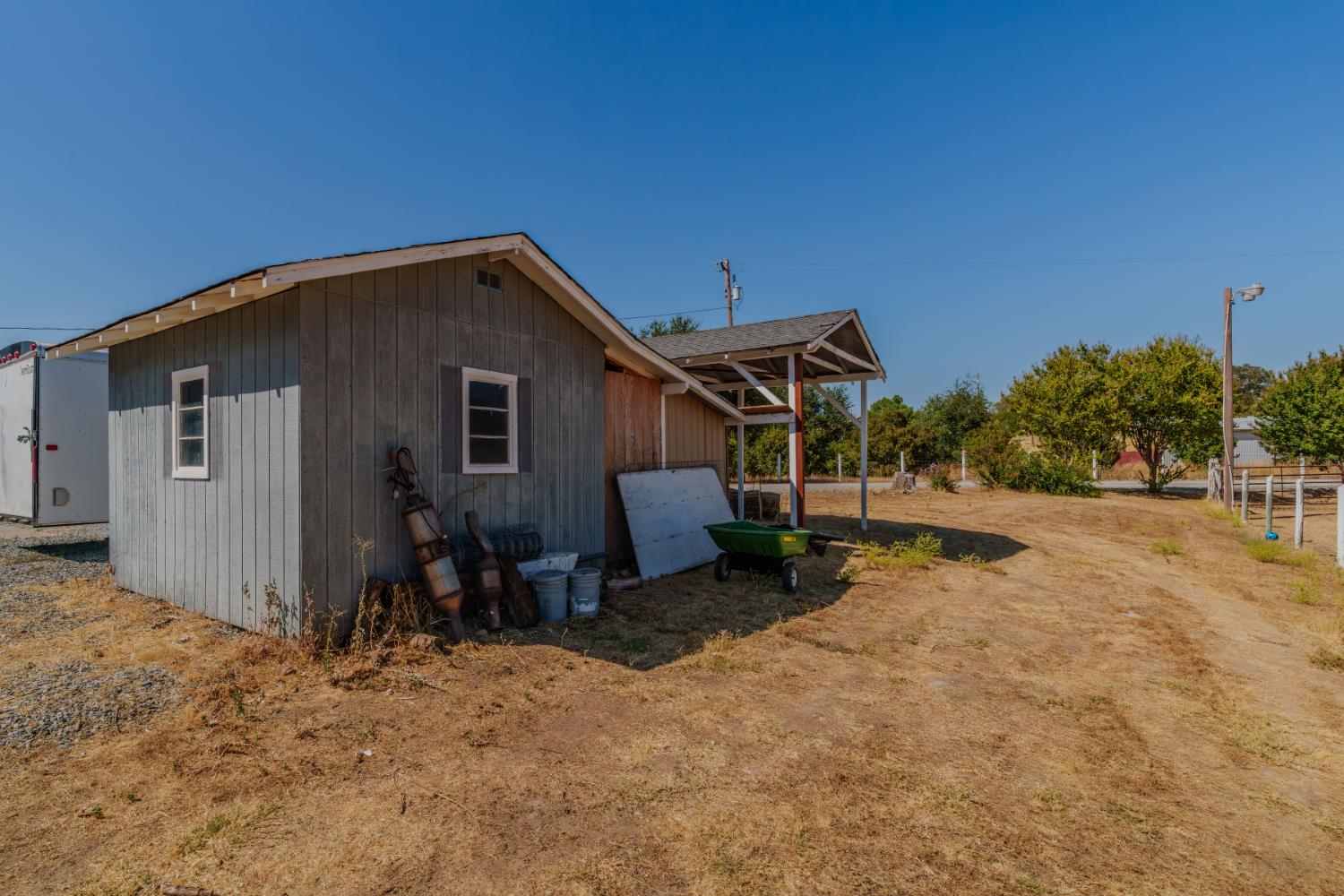 9680 Warren Road Valley Springs, CA 95252 - Photo 40 of 51 a view of a house with backyard and trees