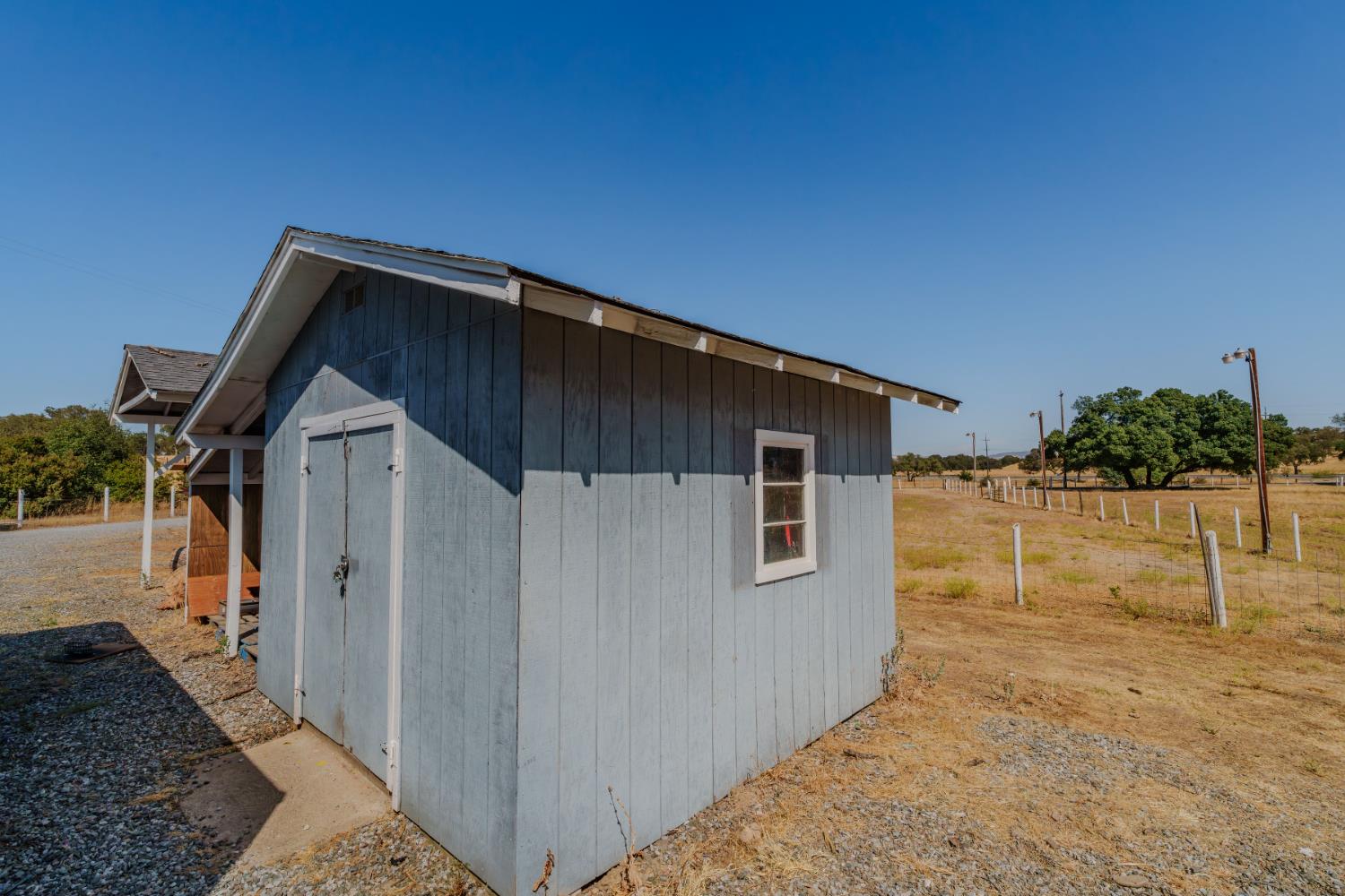 9680 Warren Road Valley Springs, CA 95252 - Photo 42 of 51 a view of house with wooden fence