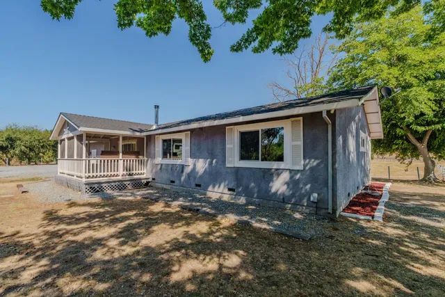 an outdoor view of house with yard