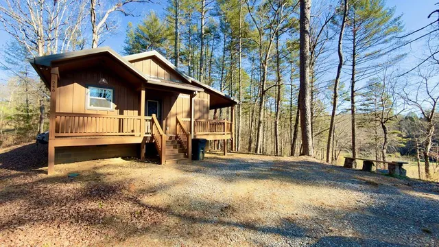 a view of a house with a large tree