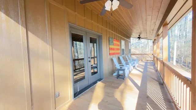 a view of a living room with furniture and a window