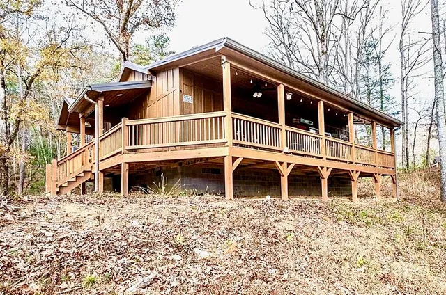 a view of a house with a yard and balcony