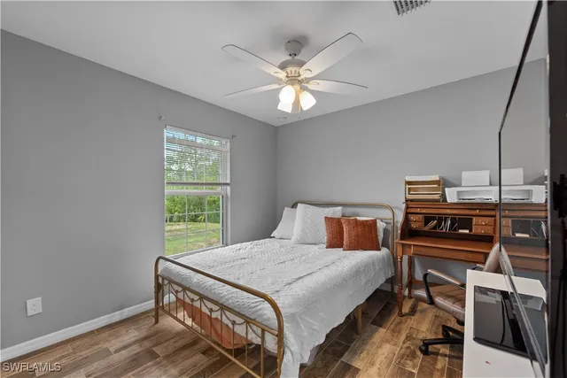 a bedroom with a bed and a bookshelf