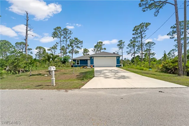 a view of a house with garden and street view