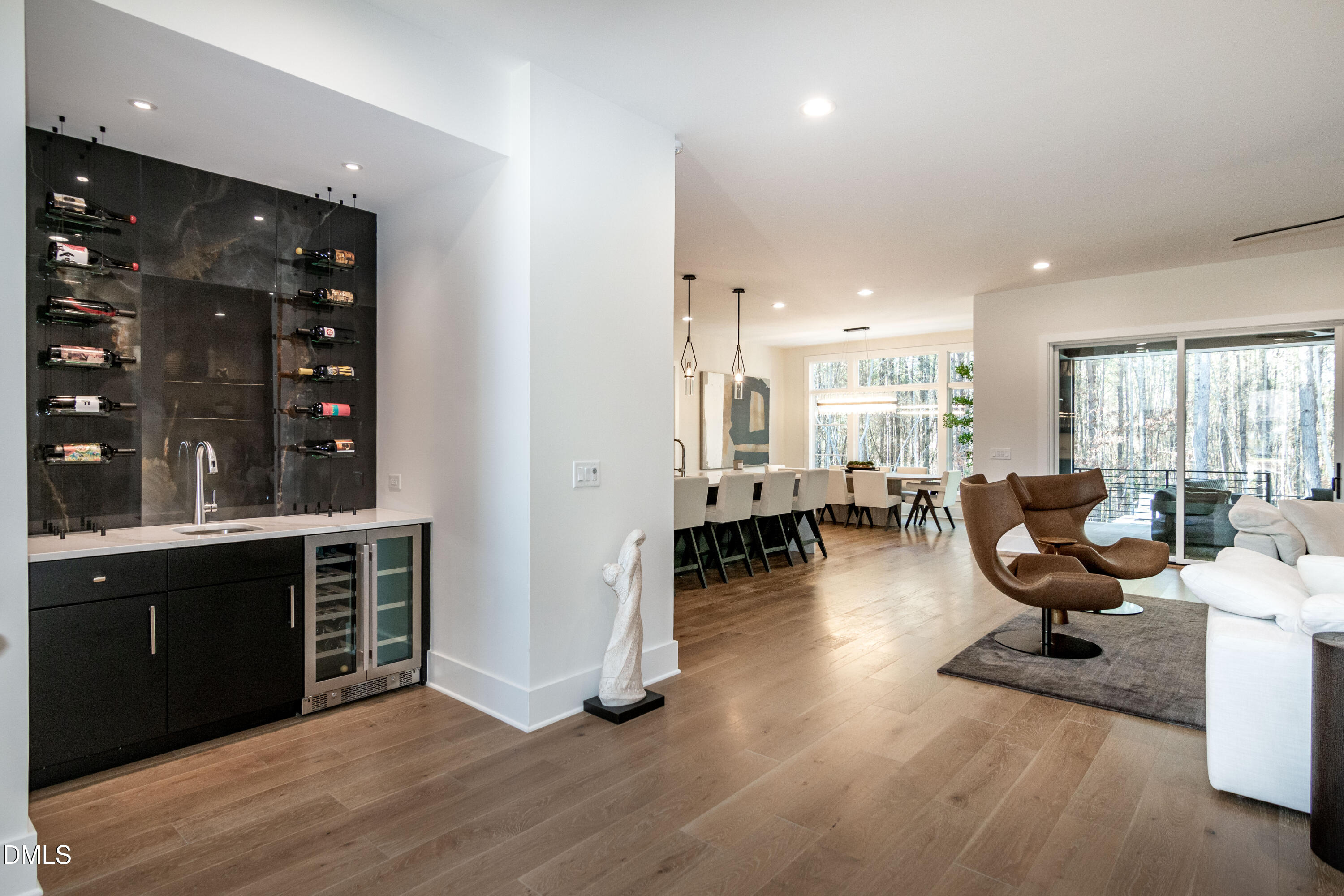 7644 Falls Creek Lane Raleigh, NC 27614 - Photo 11 of 58 a living room with furniture large window and wooden floor