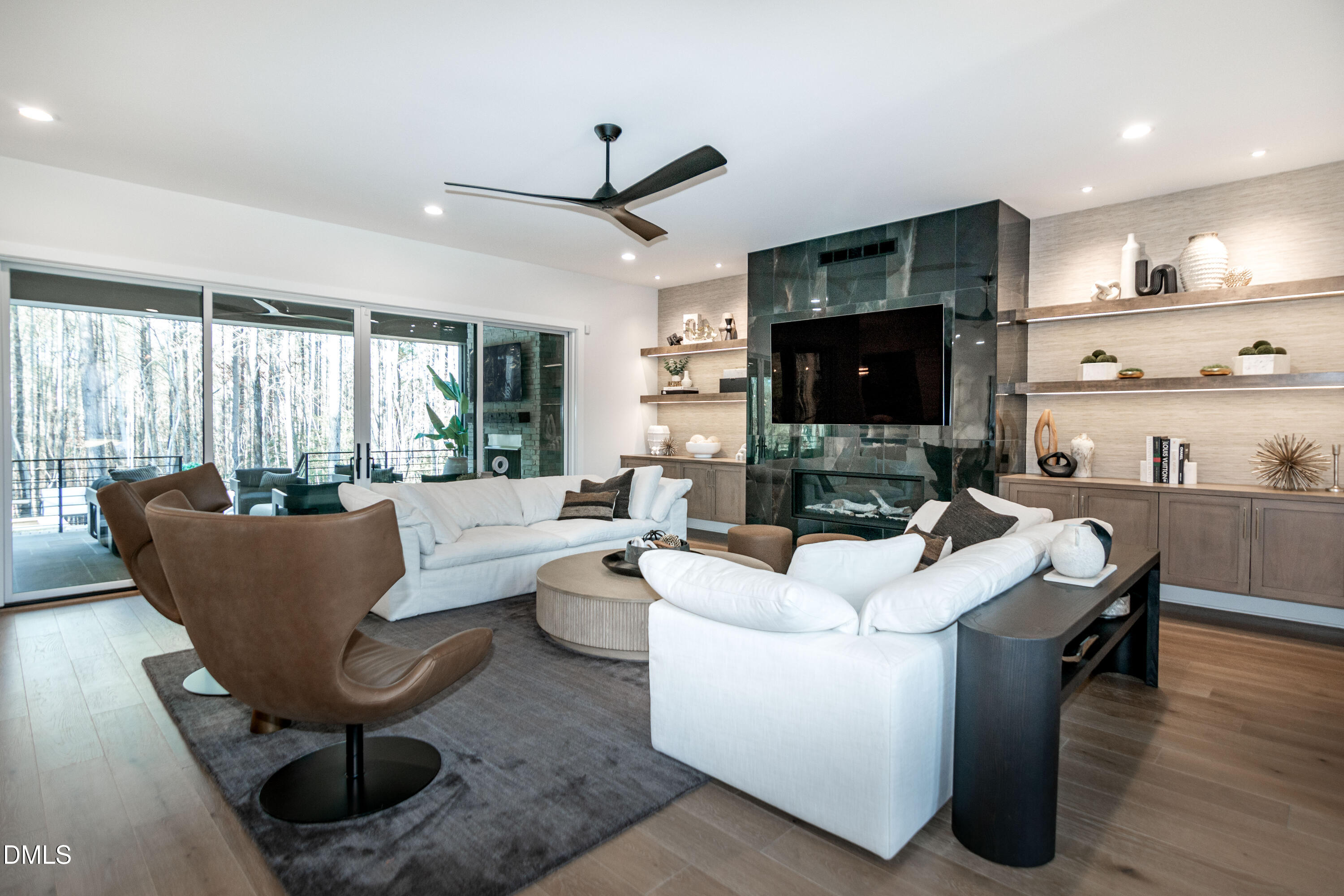7644 Falls Creek Lane Raleigh, NC 27614 - Photo 12 of 58 a living room with couches a coffee table and a flat screen tv