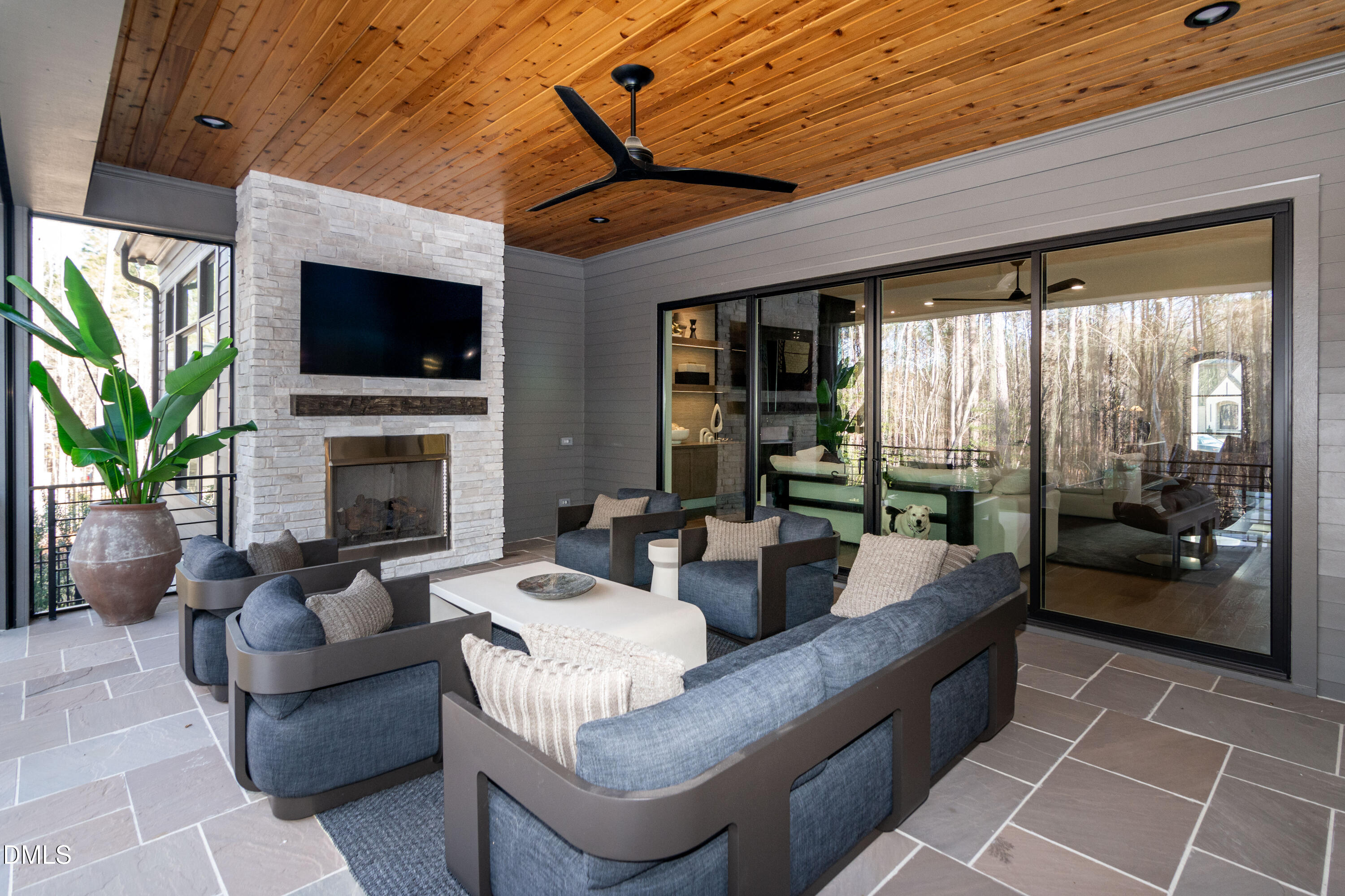 7644 Falls Creek Lane Raleigh, NC 27614 - Photo 16 of 58 a living room with furniture a flat screen tv and a fireplace