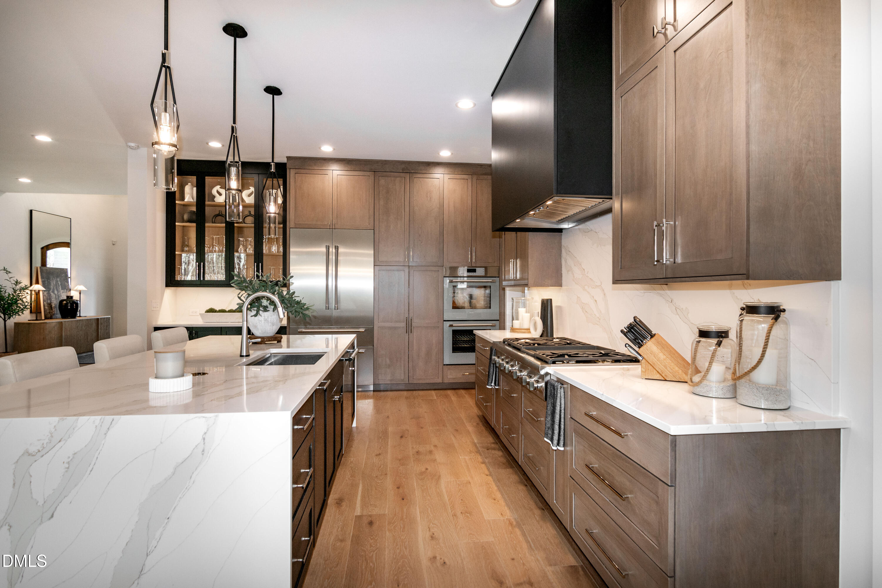 7644 Falls Creek Lane Raleigh, NC 27614 - Photo 20 of 58 a kitchen with a stove a sink a refrigerator and chairs
