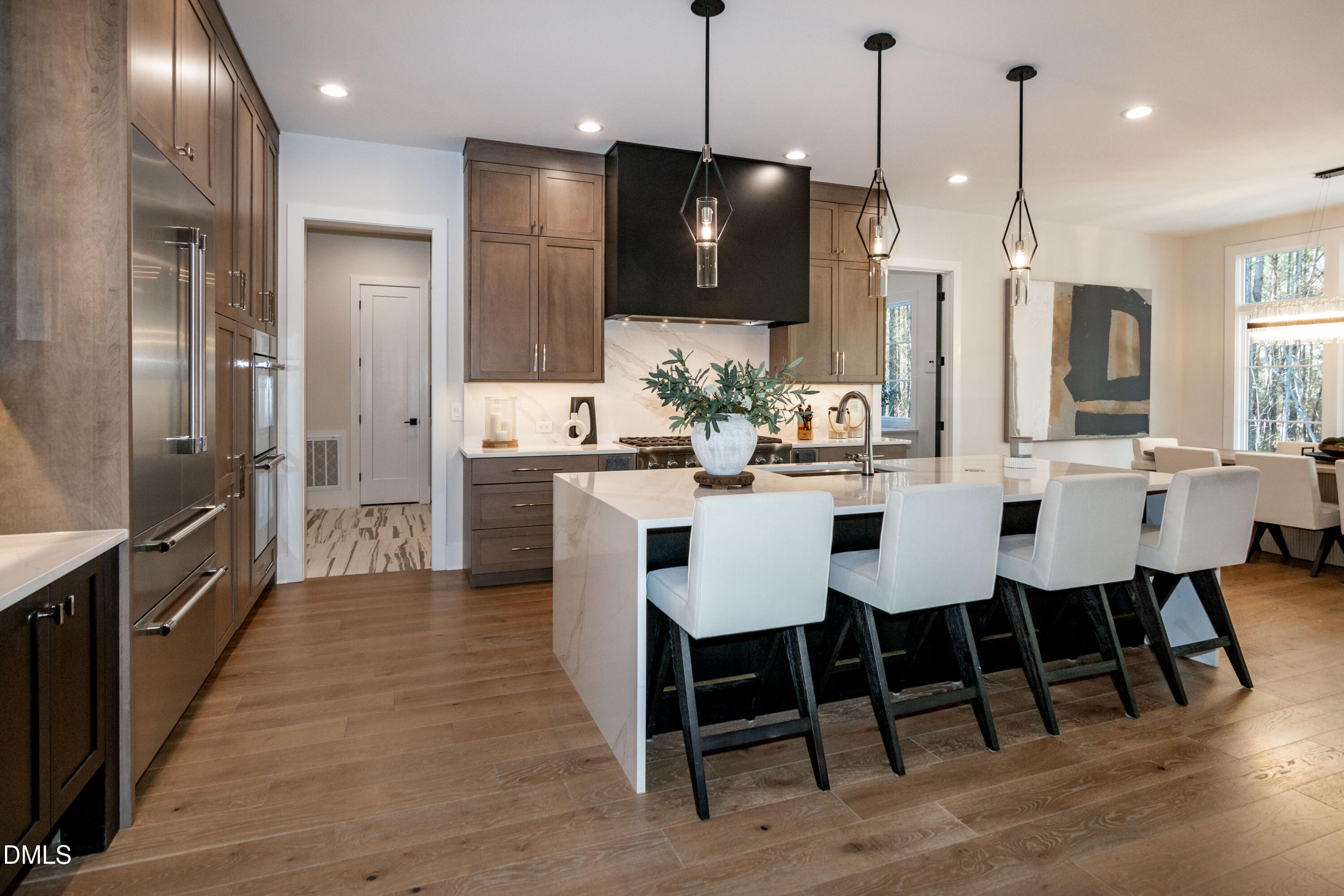 7644 Falls Creek Lane Raleigh, NC 27614 - Photo 21 of 58 a large kitchen with a table and chairs