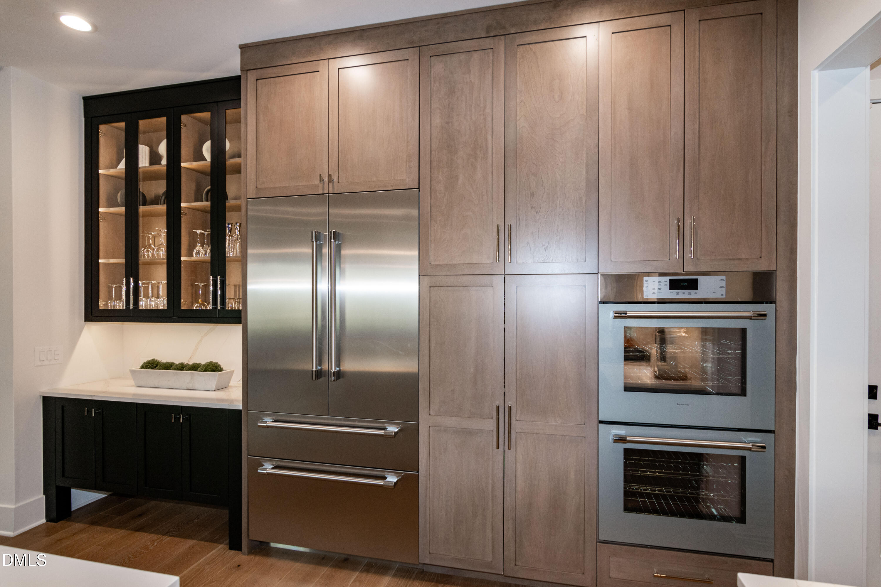 7644 Falls Creek Lane Raleigh, NC 27614 - Photo 23 of 58 a metallic refrigerator freezer sitting in a kitchen
