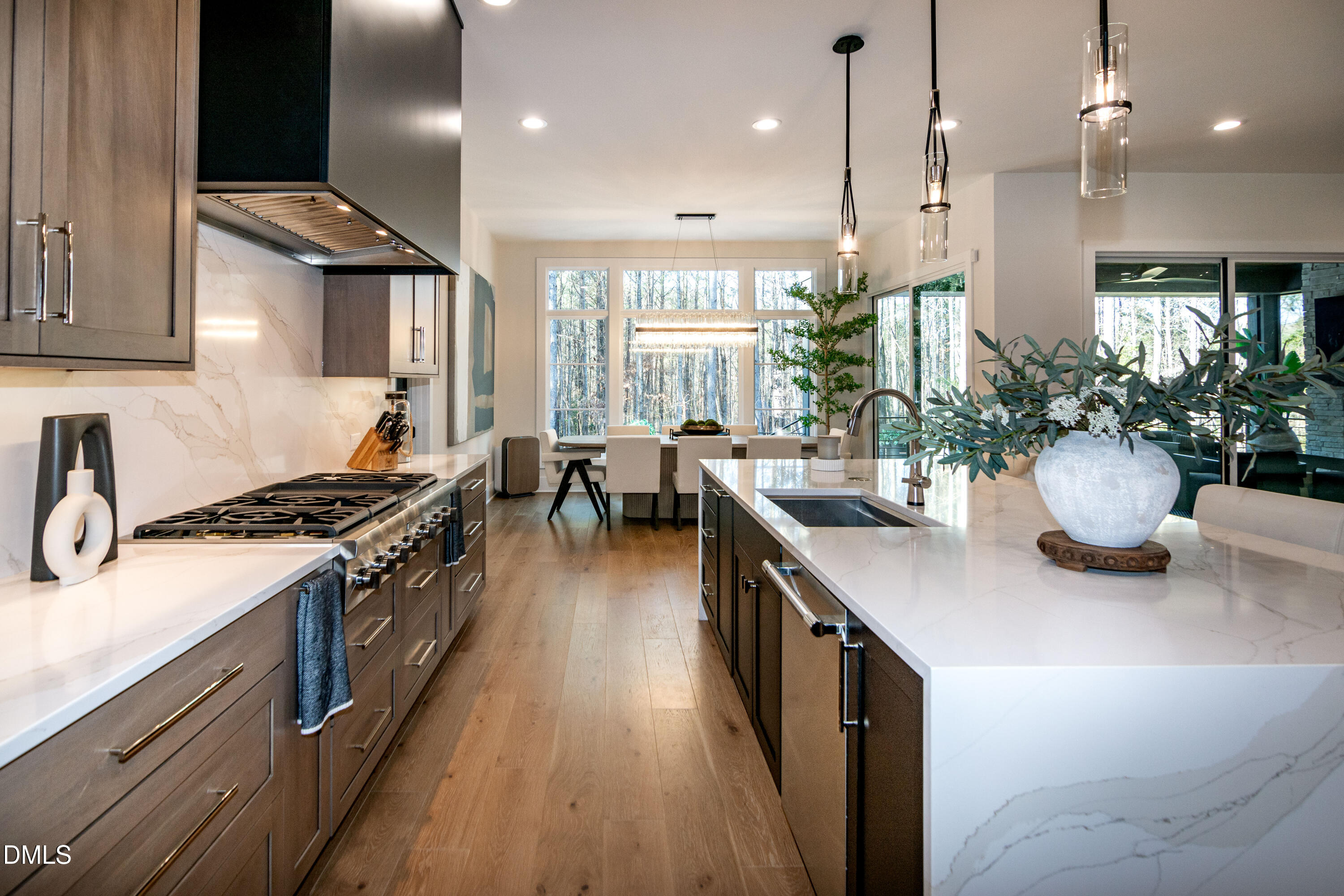 7644 Falls Creek Lane Raleigh, NC 27614 - Photo 24 of 58 a kitchen with sink stove and wooden floor