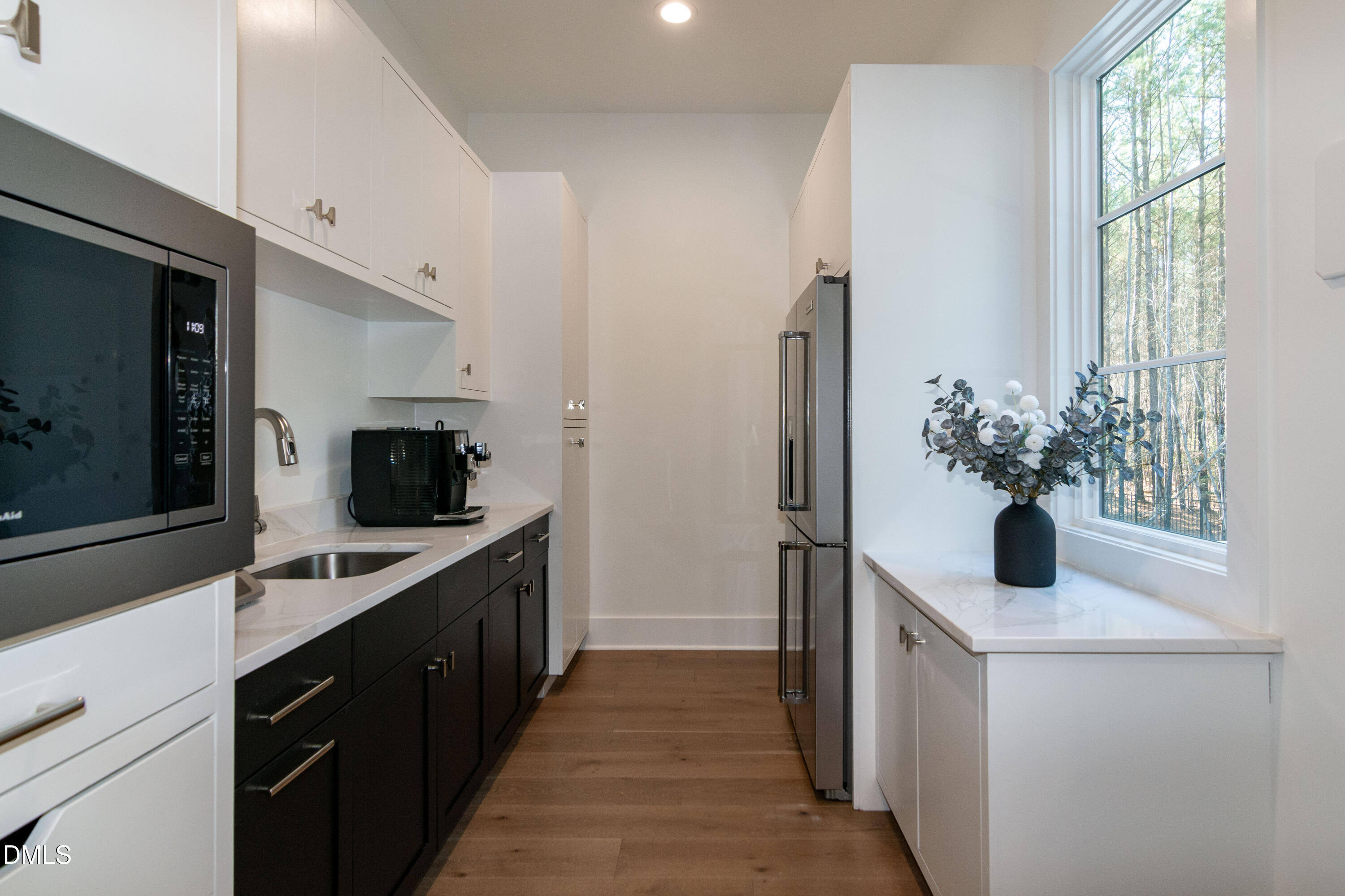 7644 Falls Creek Lane Raleigh, NC 27614 - Photo 26 of 58 a kitchen with a sink and refrigerator