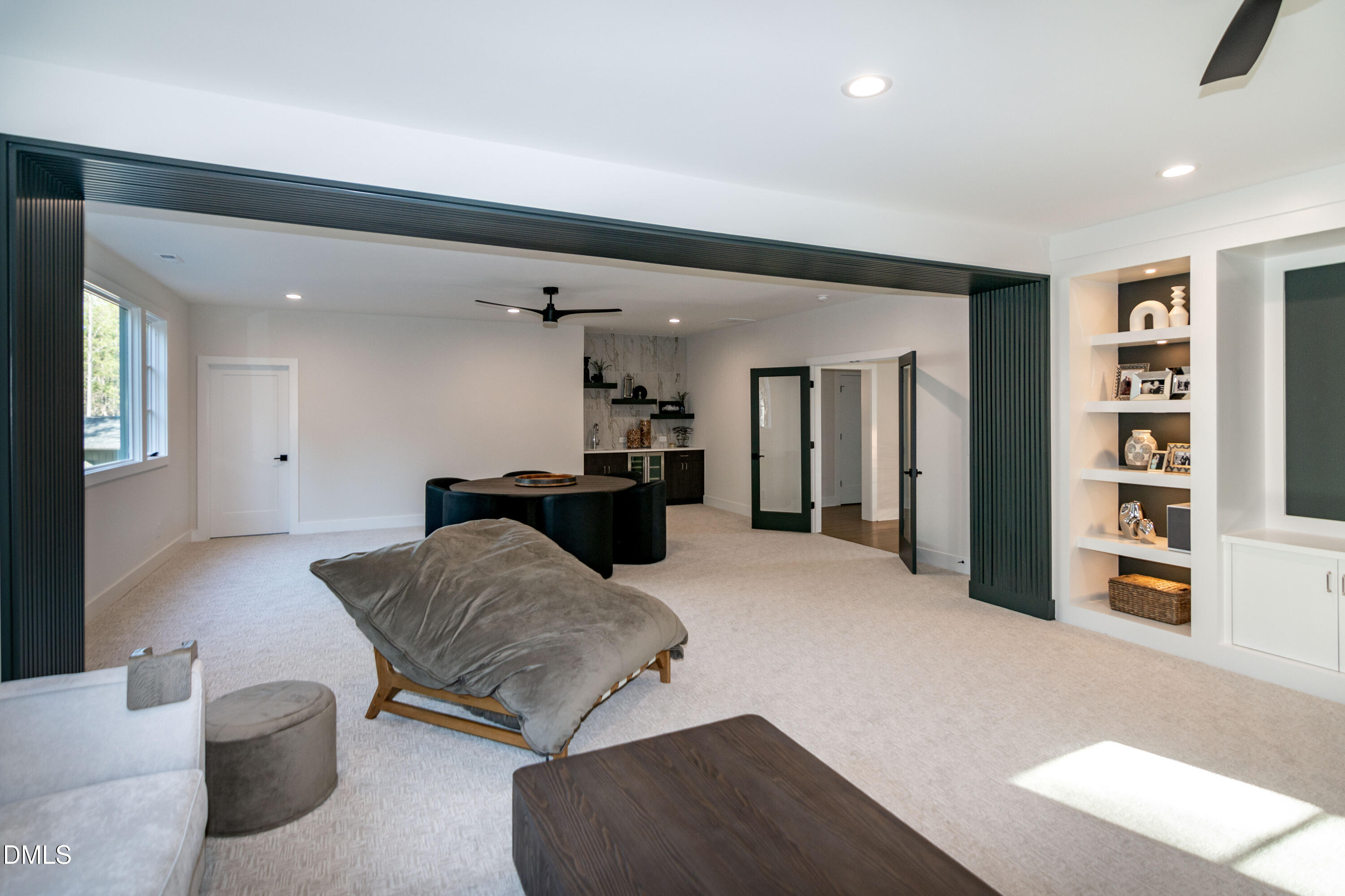 7644 Falls Creek Lane Raleigh, NC 27614 - Photo 46 of 58 a living room with furniture and a book shelf