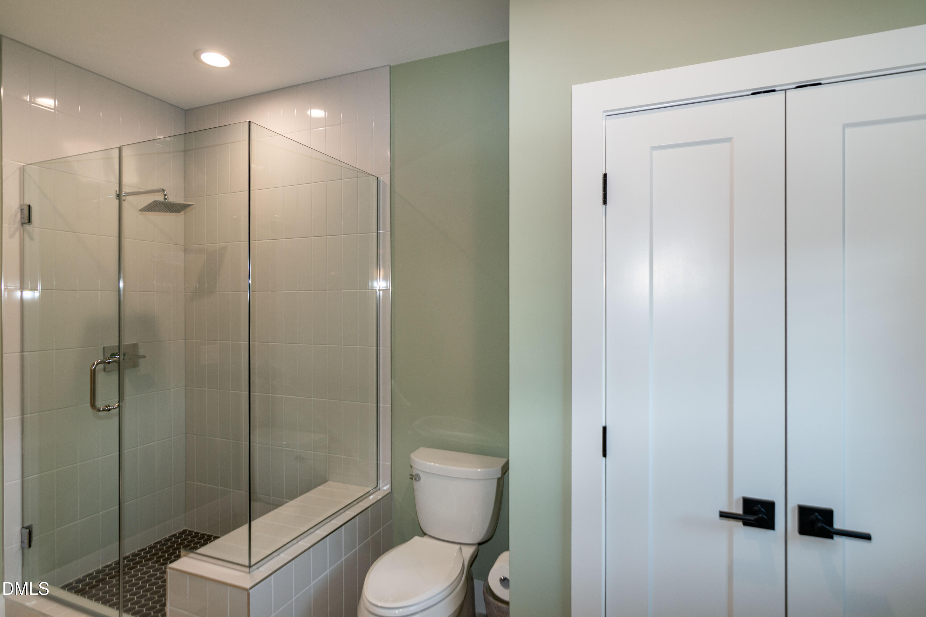 7644 Falls Creek Lane Raleigh, NC 27614 - Photo 49 of 58 a bathroom with a toilet a sink and shower