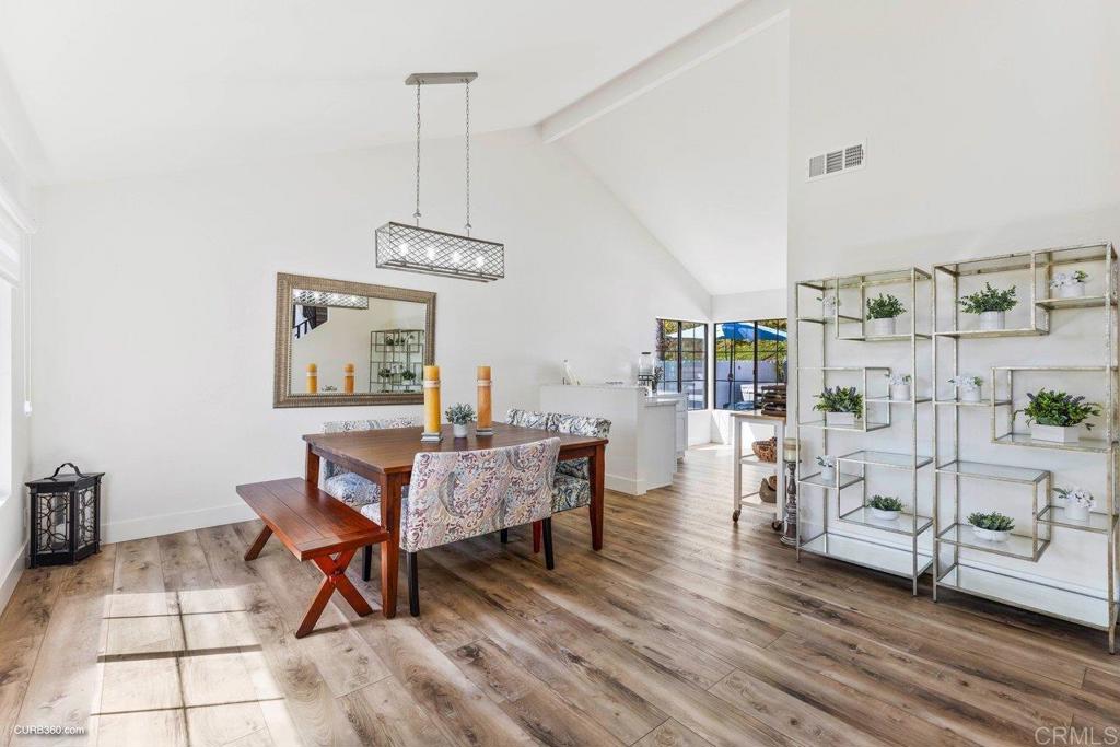 1618 Buttercup Road Encinitas, CA 92024 - Photo 11 of 33 a dining room with furniture and wooden floor